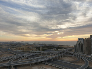 View of the new district of Dubai near the sea during sunset.Shooting with a smartphone camera.