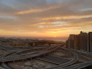 View of the new district of Dubai near the sea during sunset.Shooting with a smartphone camera.