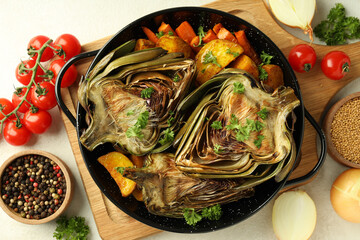 Concept of tasty food with grilled artichoke, top view