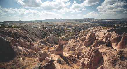 Fototapeta na wymiar Panoramic view of mountains under sun in Cappadocia, Turkey