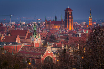 Fototapeta premium Cityscape of Gdansk with St. Mary Basilica, City Hall and the Railway Station building, Poland.
