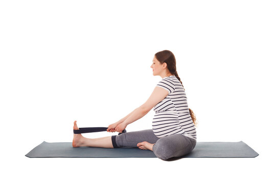 Pregnancy yoga exercise - pregnant woman doing yoga asana Janu Sirsasana A Head-to-Knee Forward Bend isolated on white background