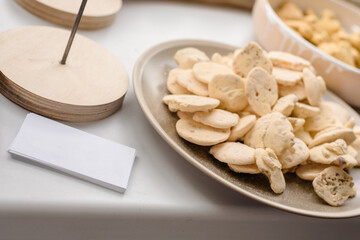 Closeup photo of modern front desk with baking cookies and business cards