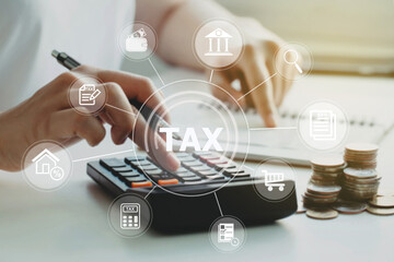 women using calculator calculated individual income tax for pay taxes annual.Financial research,government taxes and calculation tax return concept. Tax and Vat concept. - obrazy, fototapety, plakaty