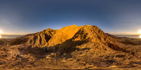 360 panorama hdr view from the height of the mountains range with shadow of silhouette of man to...