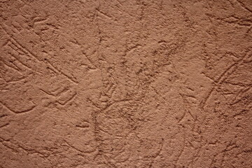Old scratched brown texture of concrete stone wall background.