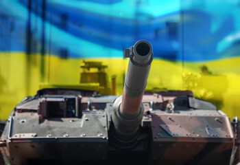 Leopard main battle tank, Ukraine flag. Military heavy vehicle. Army equipment for war and defense © Rawf8
