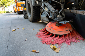 Street sweepers are cleaning city street