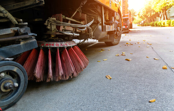Street sweepers are cleaning city street