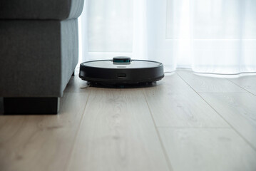 Robot vacuum cleaner is cleaning floor, top view