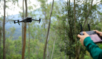 Drone flying in spring forest