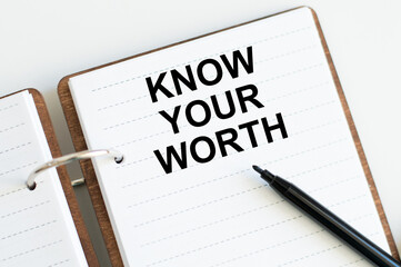 Know Your Worth inscription on a notebook on a desk, a business concept