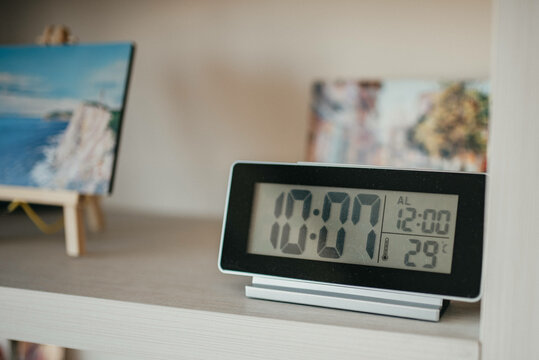 Turning off an alarm clock stock photo.