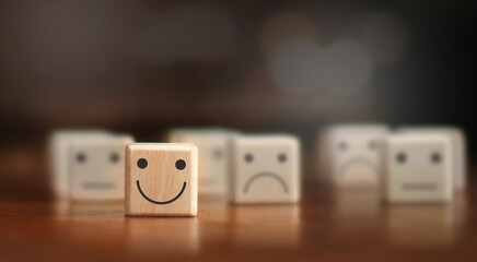wooden cube blocks, concepts, emotions and thoughts A clearly smiling face of wood blocks at the...