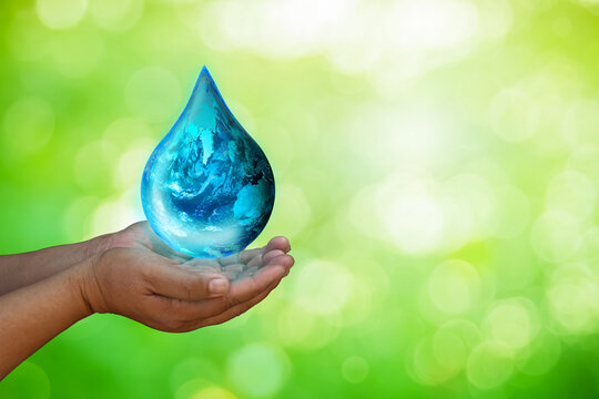 Earth fuel drop was holding in human hands. World environment day and green earth. Energy saving environment nature conservation concept.