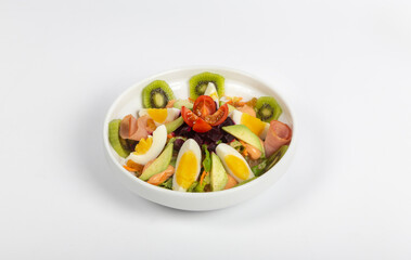 Healthy salad mixed of vegetables and fruits with eggs