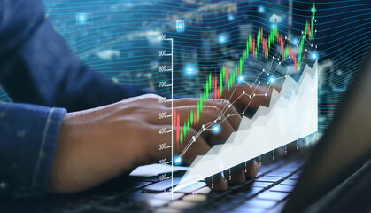 A trader at the home office working on a laptop with graphs and diagrams. Businessman analyzing index, financial chart, online trading, investment data on cryptocurrency, and the stock market.