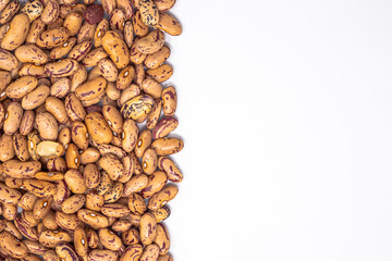 dry brown beans on white background. copy space