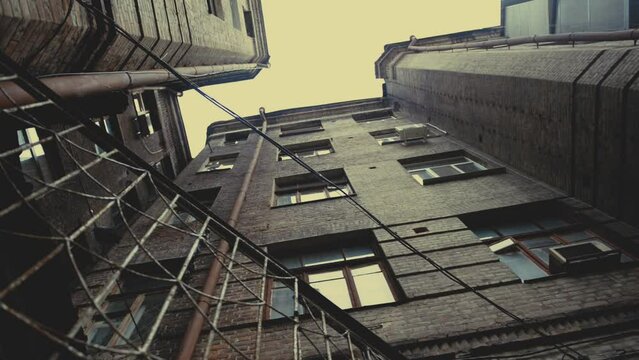 Kharkov courtyards. A well of houses, circular shooting. Pigeon on electric wires. Overcast weather.