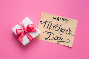 Women mothers day concept with pink ribbon fift box