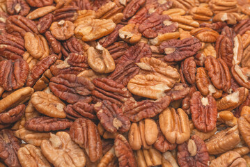 Tasty pecan-nut background. Top view.