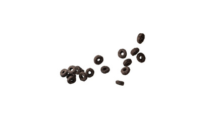 Chocolate rings cereal spill out into a bowl. Breakfast.