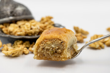 Walnut baklava on a white background. Traditional Turkish cuisine delicacies. Local name is cevizli...