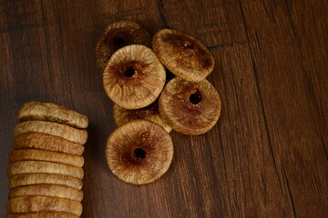 Fresh almonds in the wooden bowl, Organic almonds, almonds border white background, Almond nuts on a dark wooden background. Healthy snacks. Top view. Free space for text.