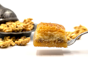 Walnut baklava on a white background. Traditional Turkish cuisine delicacies.