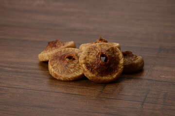 Fresh almonds in the wooden bowl, Organic almonds, almonds border white background, Almond nuts on a dark wooden background. Healthy snacks. Top view. Free space for text.