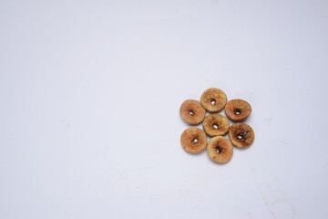Fresh almonds in the wooden bowl, Organic almonds, almonds border white background, Almond nuts on a dark wooden background. Healthy snacks. Top view. Free space for text.