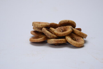 Fresh almonds in the wooden bowl, Organic almonds, almonds border white background, Almond nuts on a dark wooden background. Healthy snacks. Top view. Free space for text.