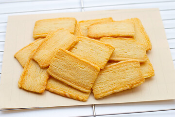 Cheese crispies on stainless steel cooling rack