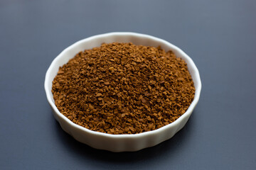 Instant coffee on dark background.