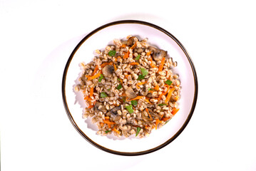 Easy bulgur pilaf (pilavi) with tomatoes in a ceramic bowl on a dark background close-up.