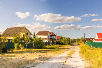 Street in the village illuminated by the sun