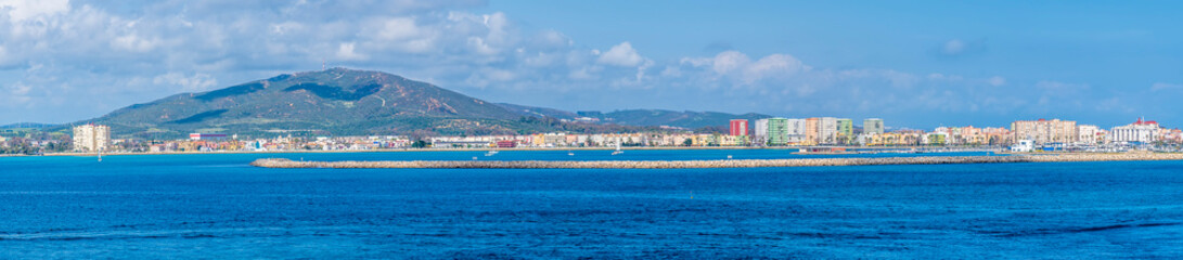 A panorama view towards the runway and Spain from Gibraltar Bay on a spring day