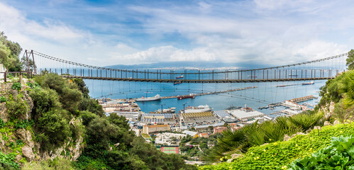A panorama view of the Windsor Suspension bridge above the town of Gibraltar on a spring day