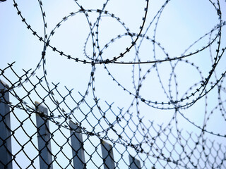 barbed wire in a prison wall