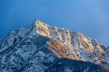 The snow-covered walls of mount Cima Vezzena (or Pizzo di Levico): on its top is the Forte Vezzena. Levico Terme, Trento province, Trentino Alto-Adige, Italy, Europe.