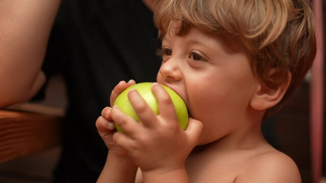 Child Eating Green Apple Little Boy Eats Fruit