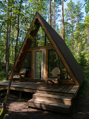 forest house for rest in the summer forest. glamping in the forest