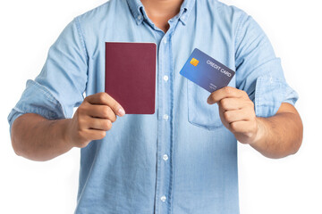 Handsome young man traveler holding passport and credit card isolated on white background. Travel and shopping concept.
