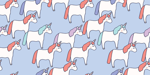 Hand drawn seamless vector pattern with cute baby unicorns on purple background. Perfect for fabric, wrapping paper or nursery decor.