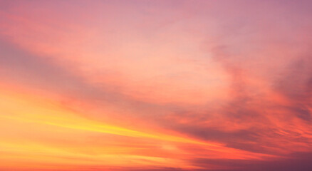 sunset sky background with romantic orange sunlight cloud 