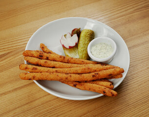 fried cheese sticks with sauce and cucumber
