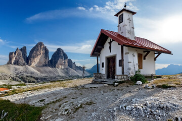 The church at the Rifugio Locatelli. In the background, the Tre Cime di Lavaredo. Sesto Dolomites, Bolzano province, Trentino Alto-Adige, Italy, Europe.