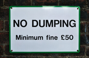 Close Up of Sign 'No Dumping-minimum Fine £50' 