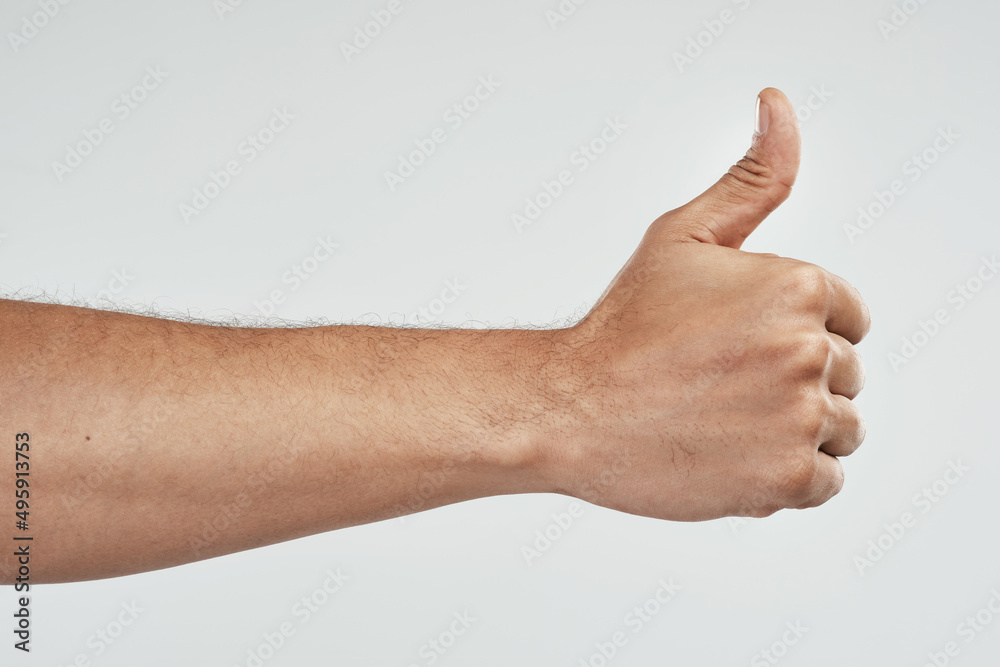 Poster youve got my vote. cropped shot of an unrecognizable man showing thumbs up.