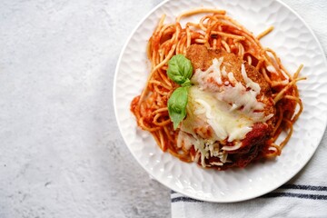 Homemade Chicken parmesan or parmigiana with cheese and sauce, selective focus